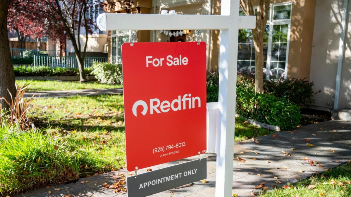 For Sale real estate sign for Redfin in front of a townhome, Walnut Creek, California.