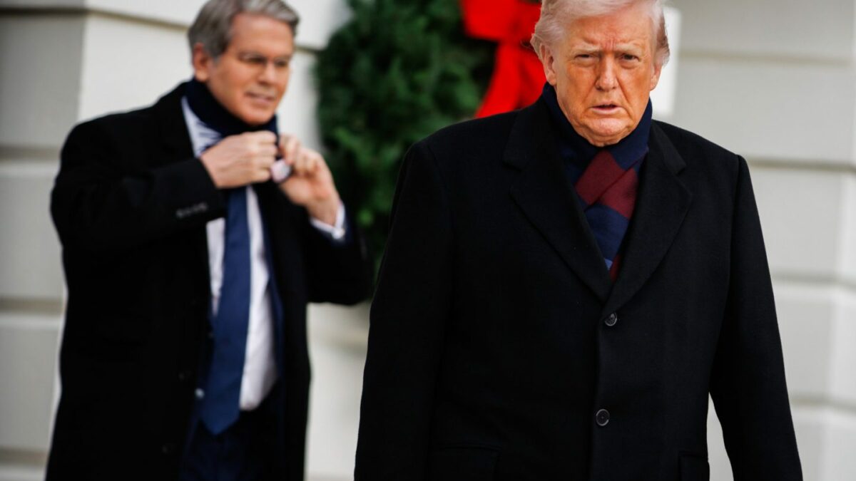 US President Donald Trump, right, followed by Scott Bessent, US treasury secretary, exit the South Portico of the White House before boarding Marine One in Washington, DC, US, on Saturday, Dec. 13, 2025.
