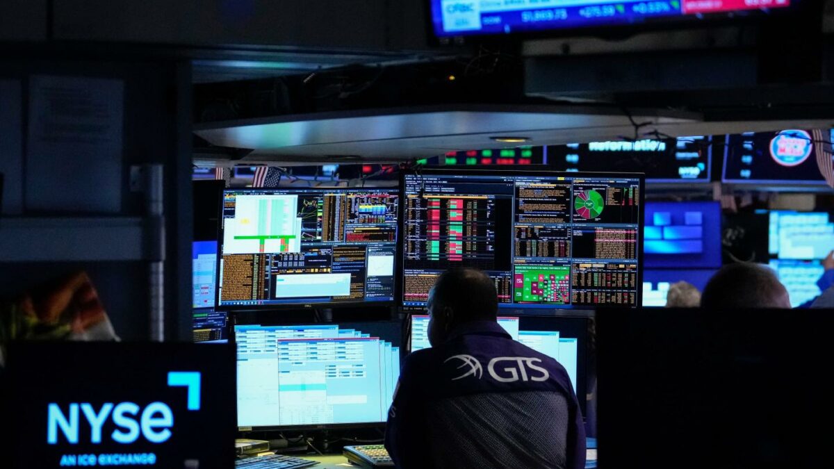 Specialist Dilip Patel works on the floor of the New York Stock Exchange.