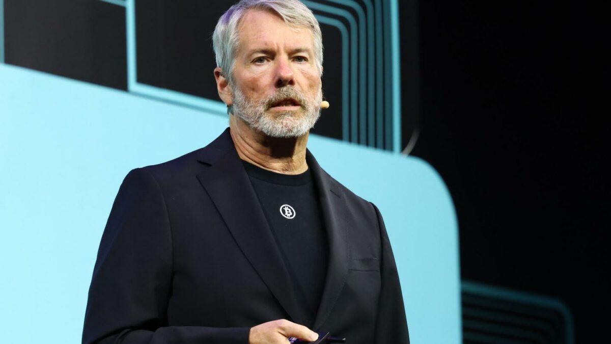 Michael Saylor speaks through a microphone as he gives a presentation.