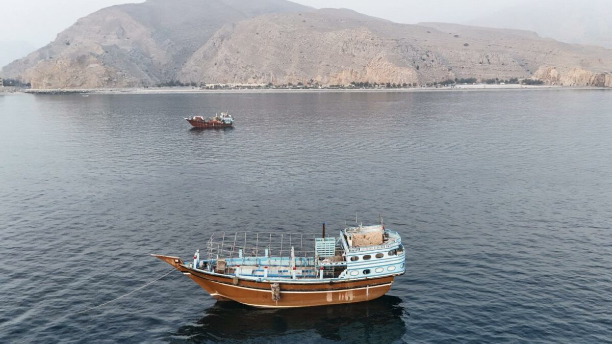 This aerial photograph shows boats anchored off Oman's northern Musandam Peninsula near the Strait of Hormuz on June 27, 2026.