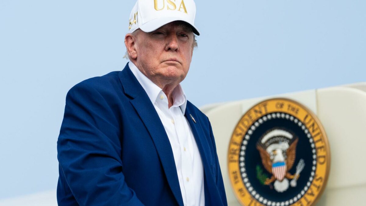 Photo of Trump with USA cap on next to Air Force One